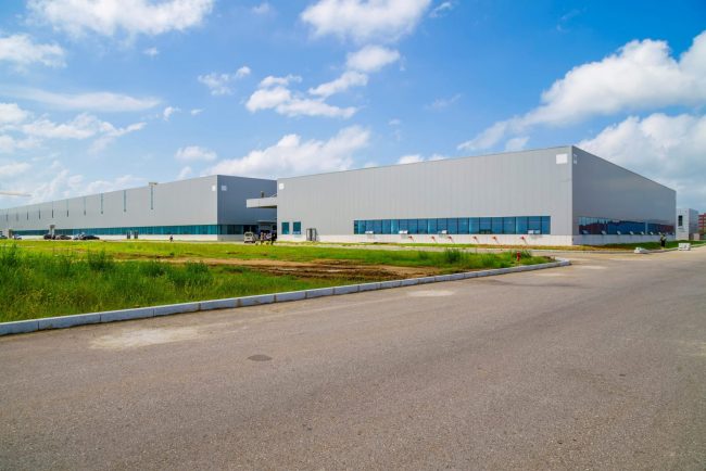 Photo of modern warehouse building illustrates blog: "Reasons to Invest in California Commercial Real Estate"